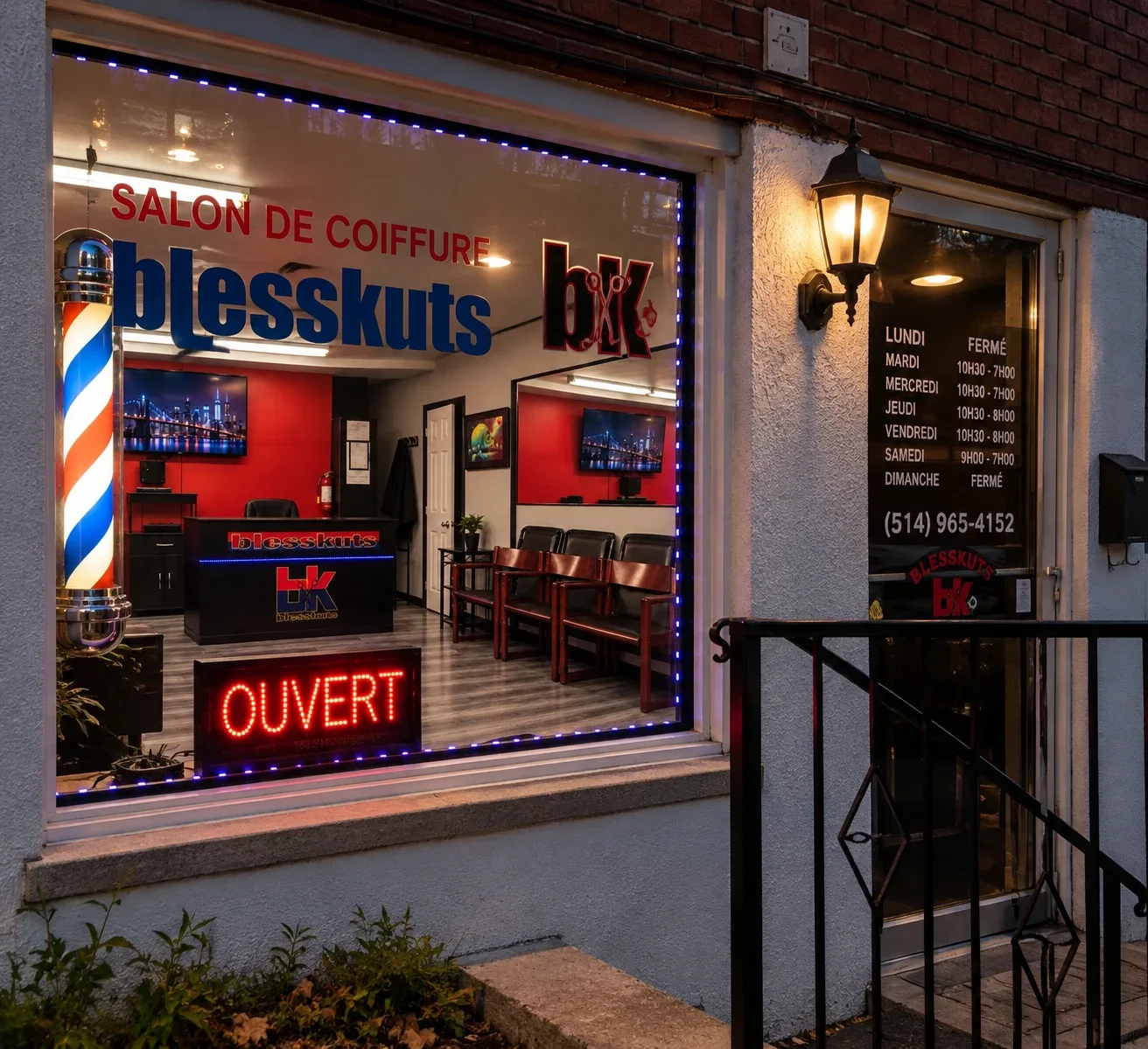 The BlessKuts storefront on Rue Provost at dusk: barber pole, lit window with the BlessKuts sign, and the door with the opening hours